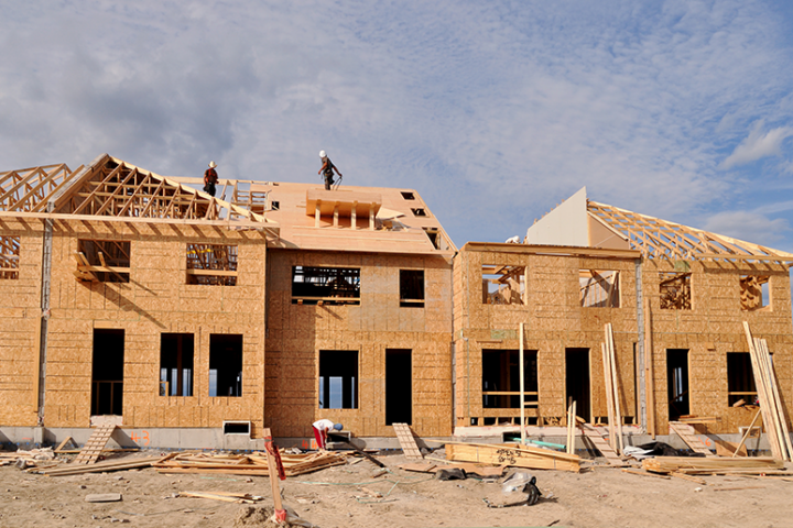 Walls going up on framework of home.