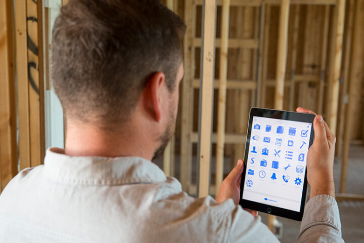 Man looking at icons on a tablet