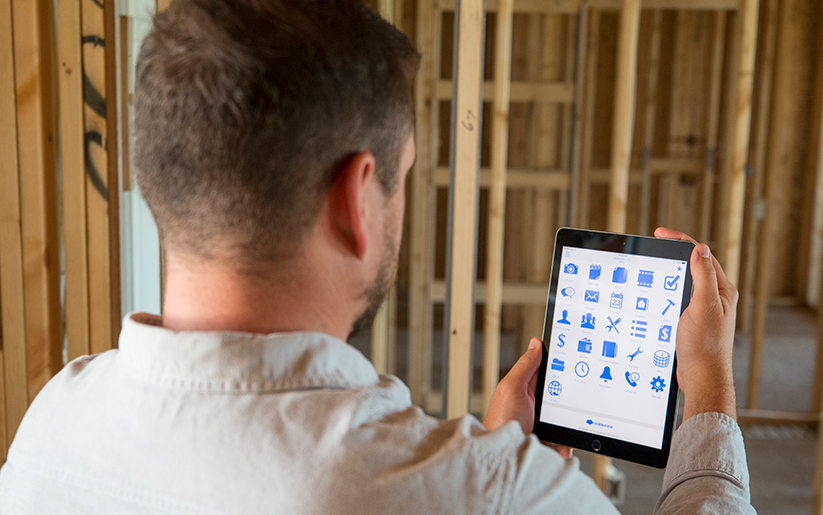 Man looking at icons on a tablet
