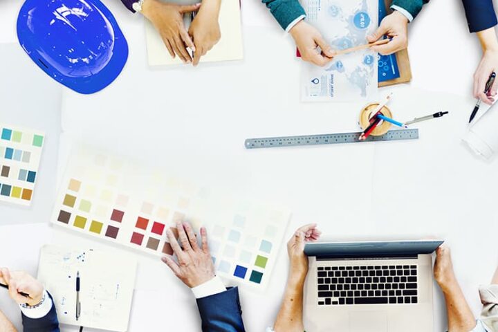 Overhead view of people working around a table