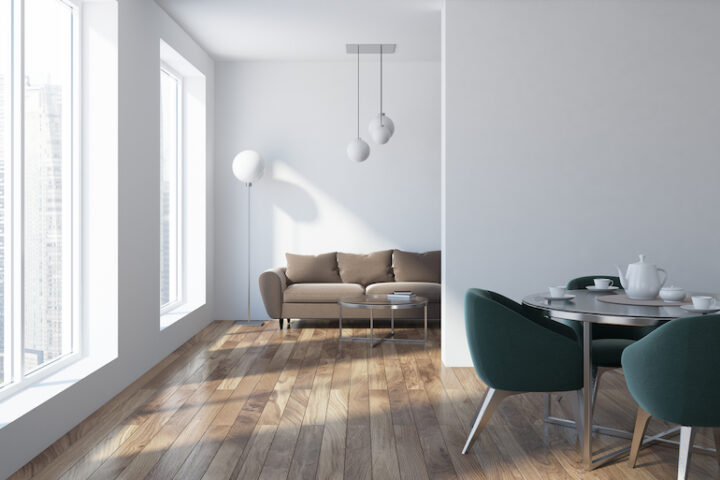 Beautiful living room with natural lighting and light-colored wood plank flooring.