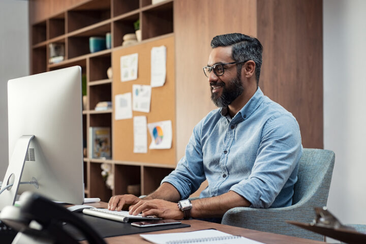 Person at a desk using a computer