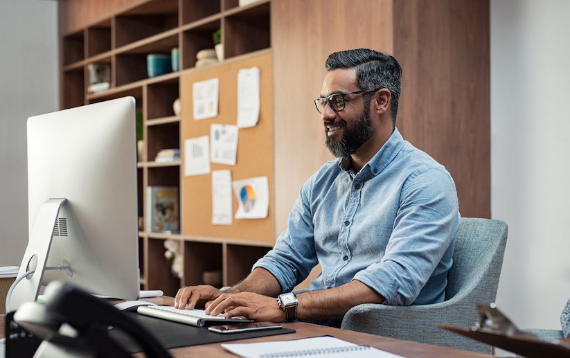 Person at a desk using a computer