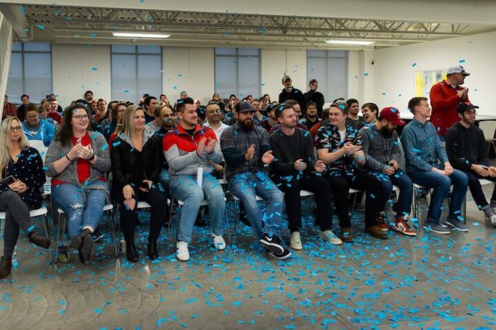 Buildertrend employees celebrating at meeting