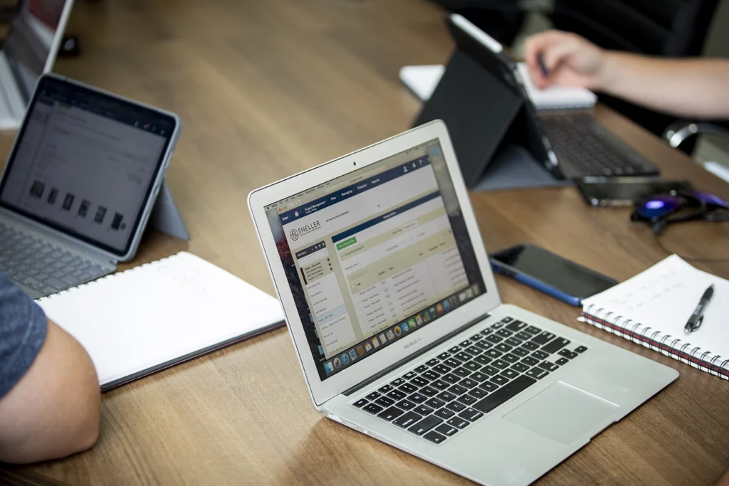 zoomed in photo of laptops on table