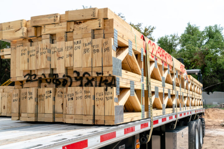 Trailer of truck with lumber on it.