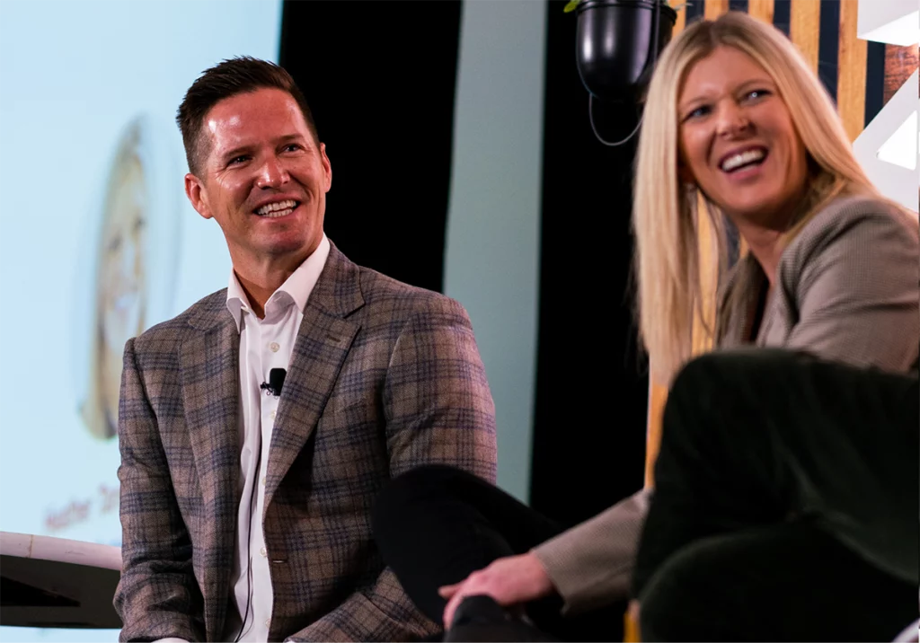 Zoomed in shot of two people hosting a panel