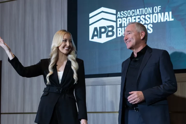 Woman and man giving a presentation on stage