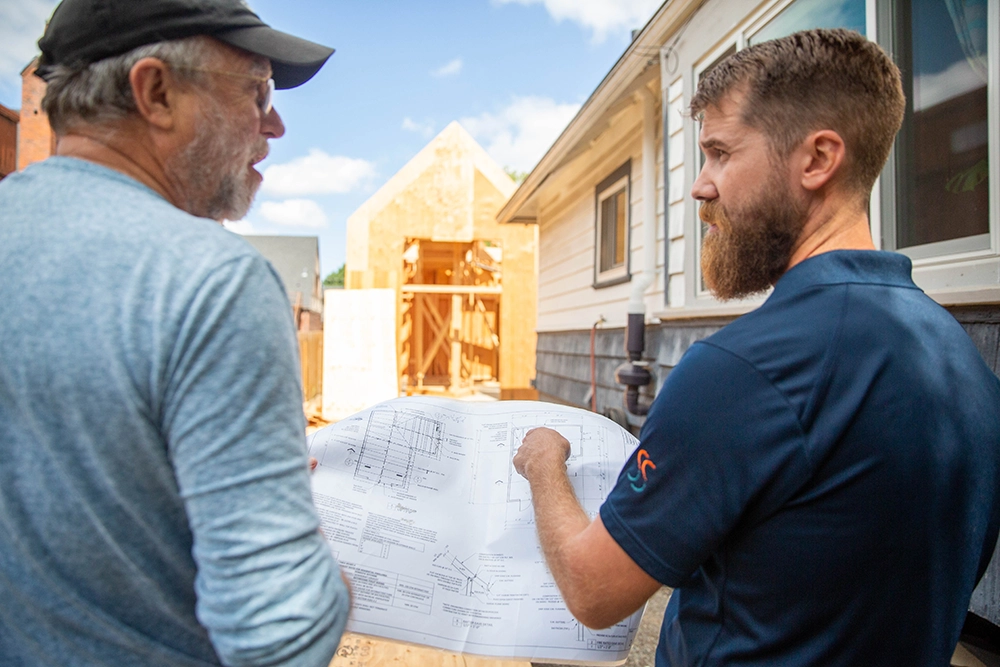 two men reviewing plans
