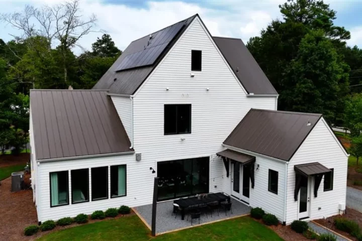 A big white house surrounded by trees