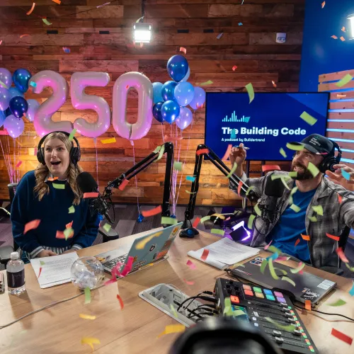 Charley and Courtney celebrating the 250th episode of The Building Code