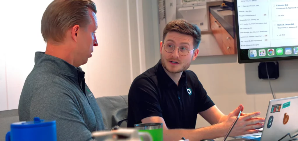 Supple Homes masthead image two men sitting and chatting