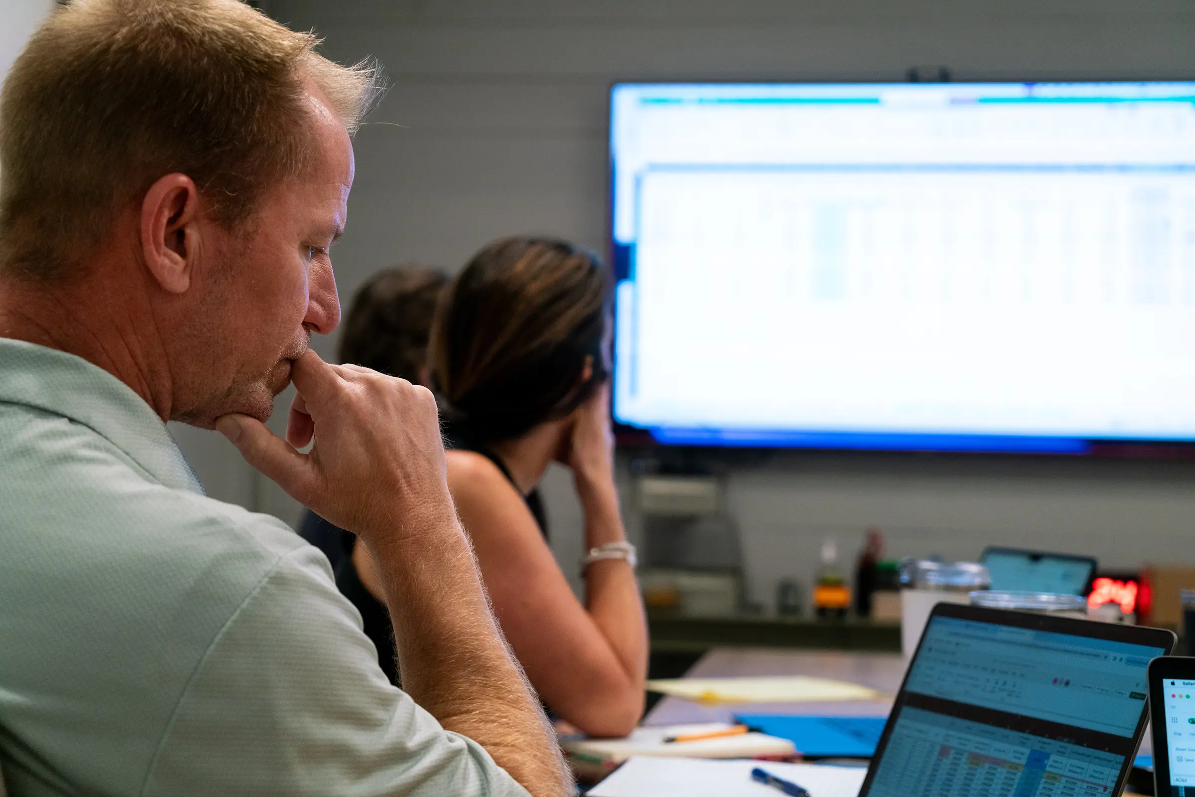 Brightwater homes team member looking at Buildertrend app