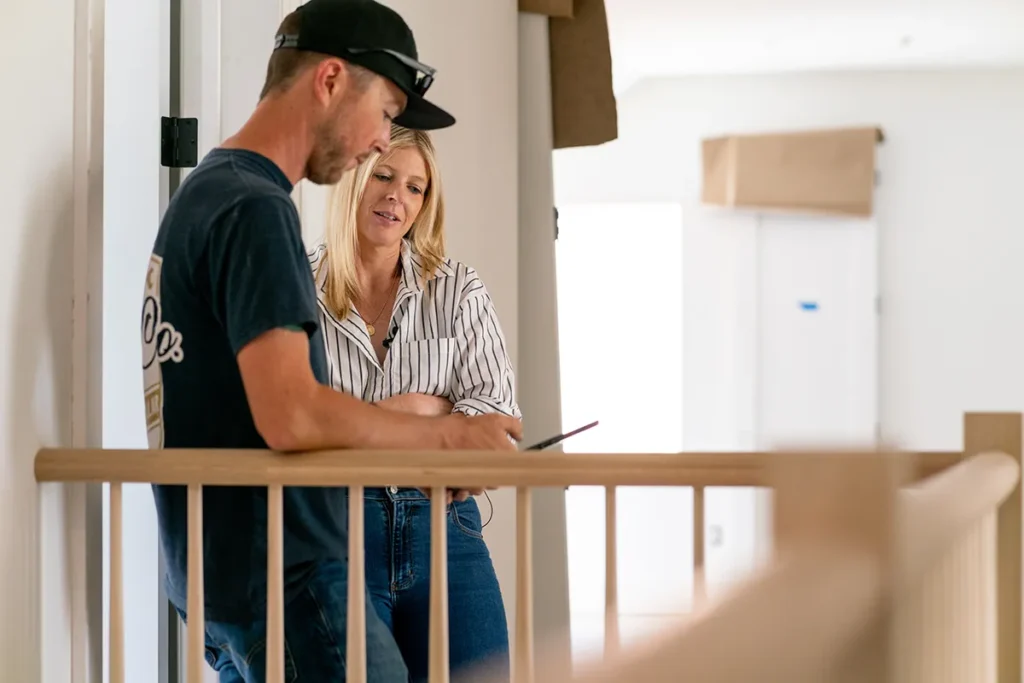 Man and woman reviewing mobile phone