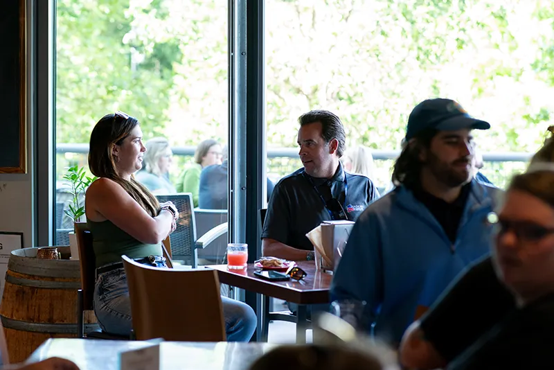 two people sitting at table