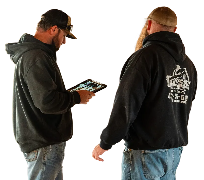two men looking at ipad