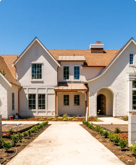 Front exterior of home with arched front entrance